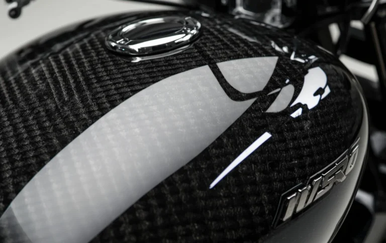 Close up of carbon fiber bike tank hydro dipping design with glossy finish