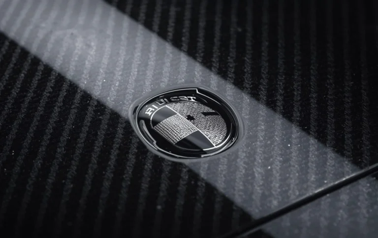 Close up of hydro dipping for car logos and badges carbon fiber texture glossy finish