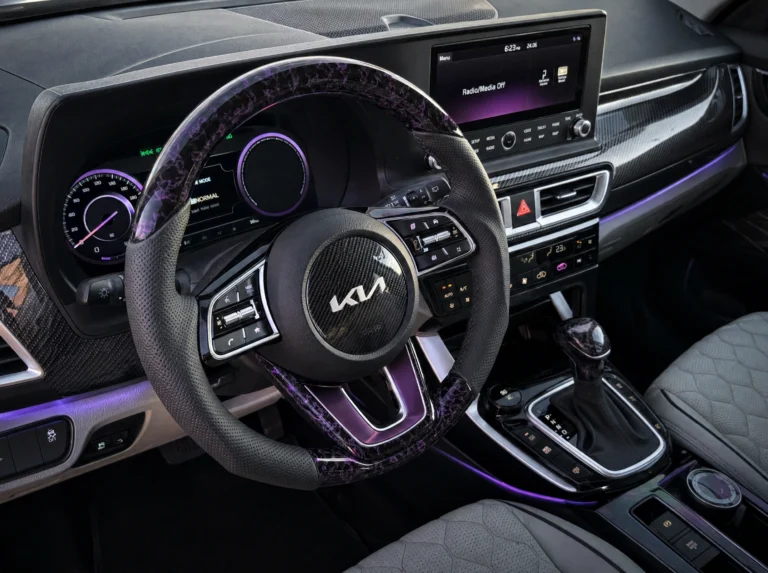 Kia Seltos interior with carbon fiber hydrodipping dashboard and piano black center console